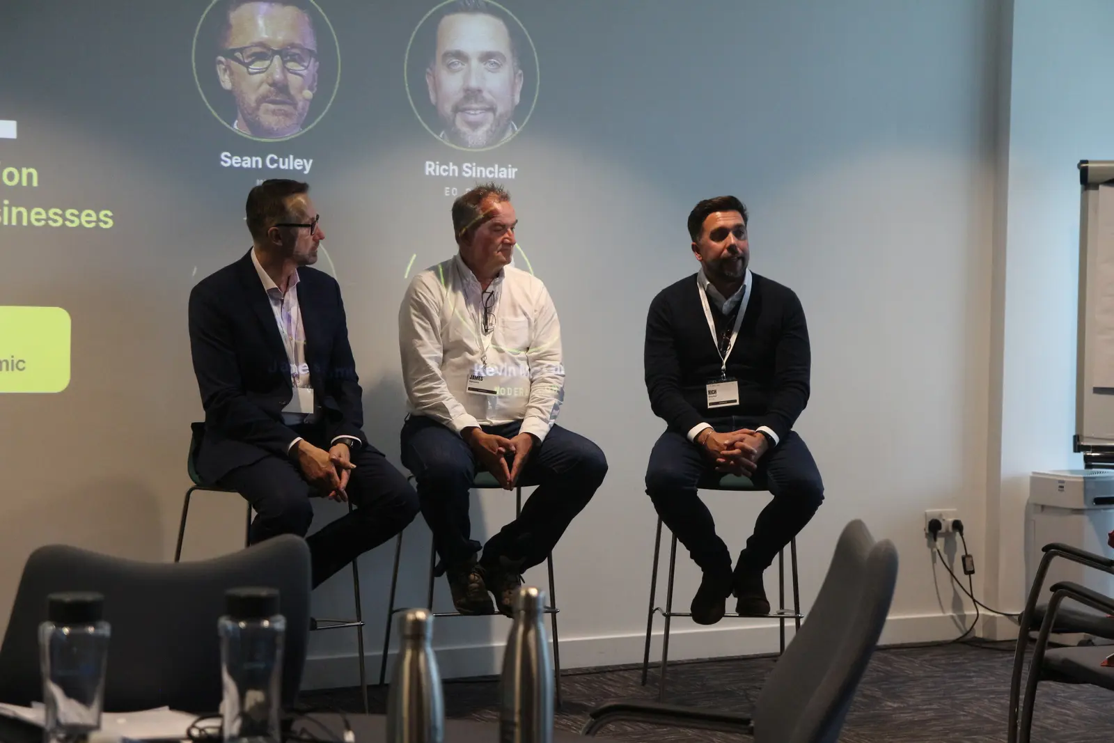 The panel on stage in front of a seated audience at AI Reality Check, MTC Coventry
